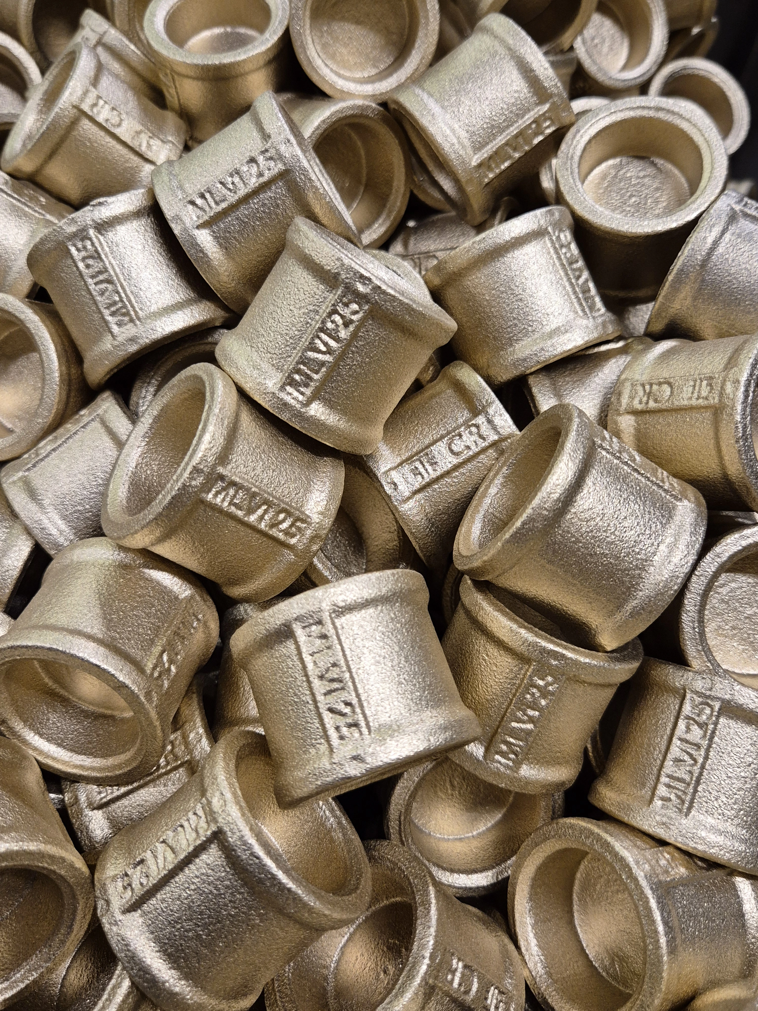 A brass part undergoing heat treatment