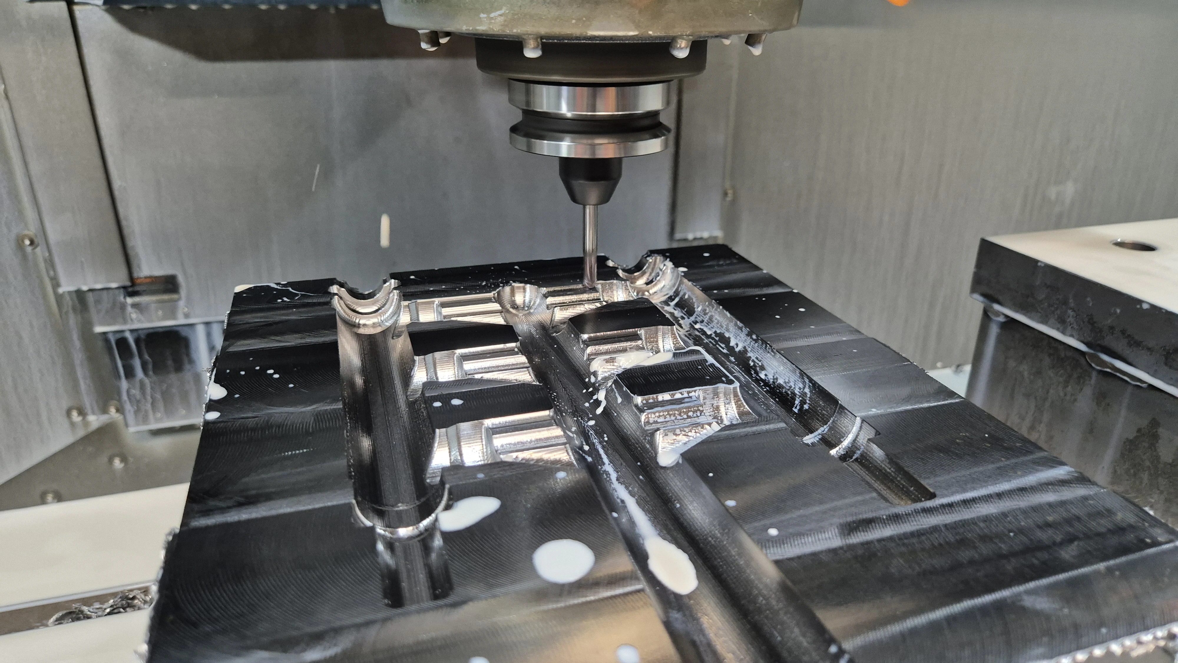 A mold being machined with a milling machine
